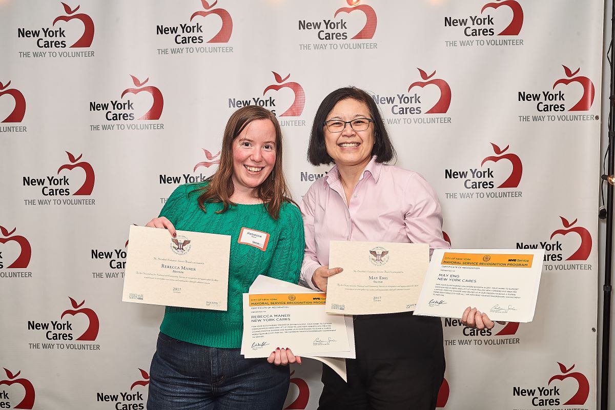 Two volunteers smiling at PVSA award ceremony