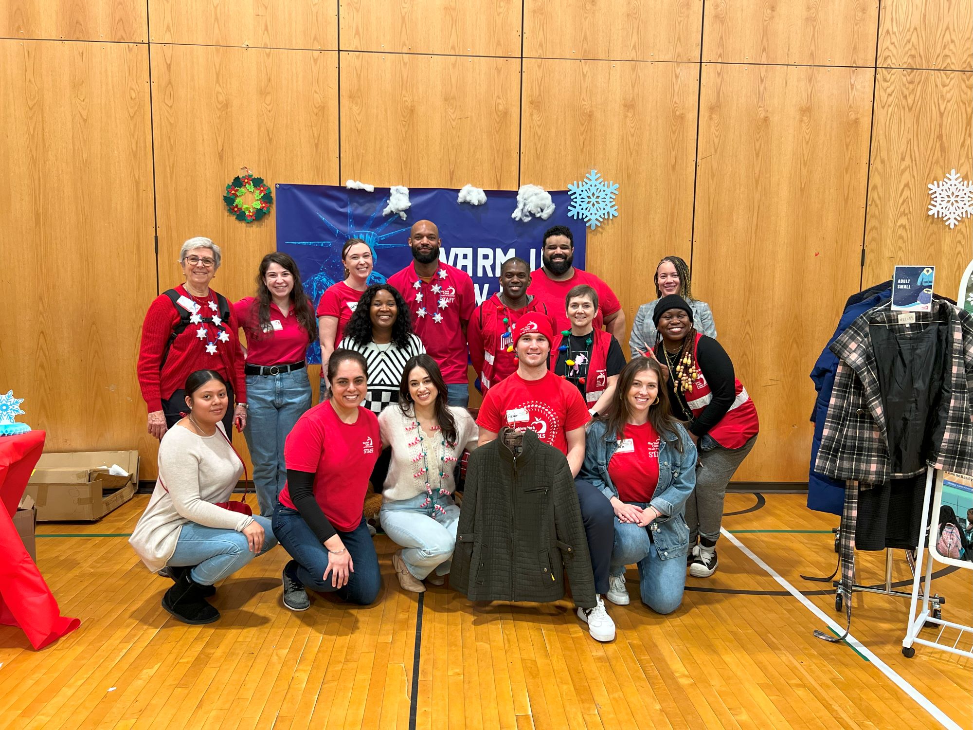 Group photo of New York Cares staff at a coat distribution