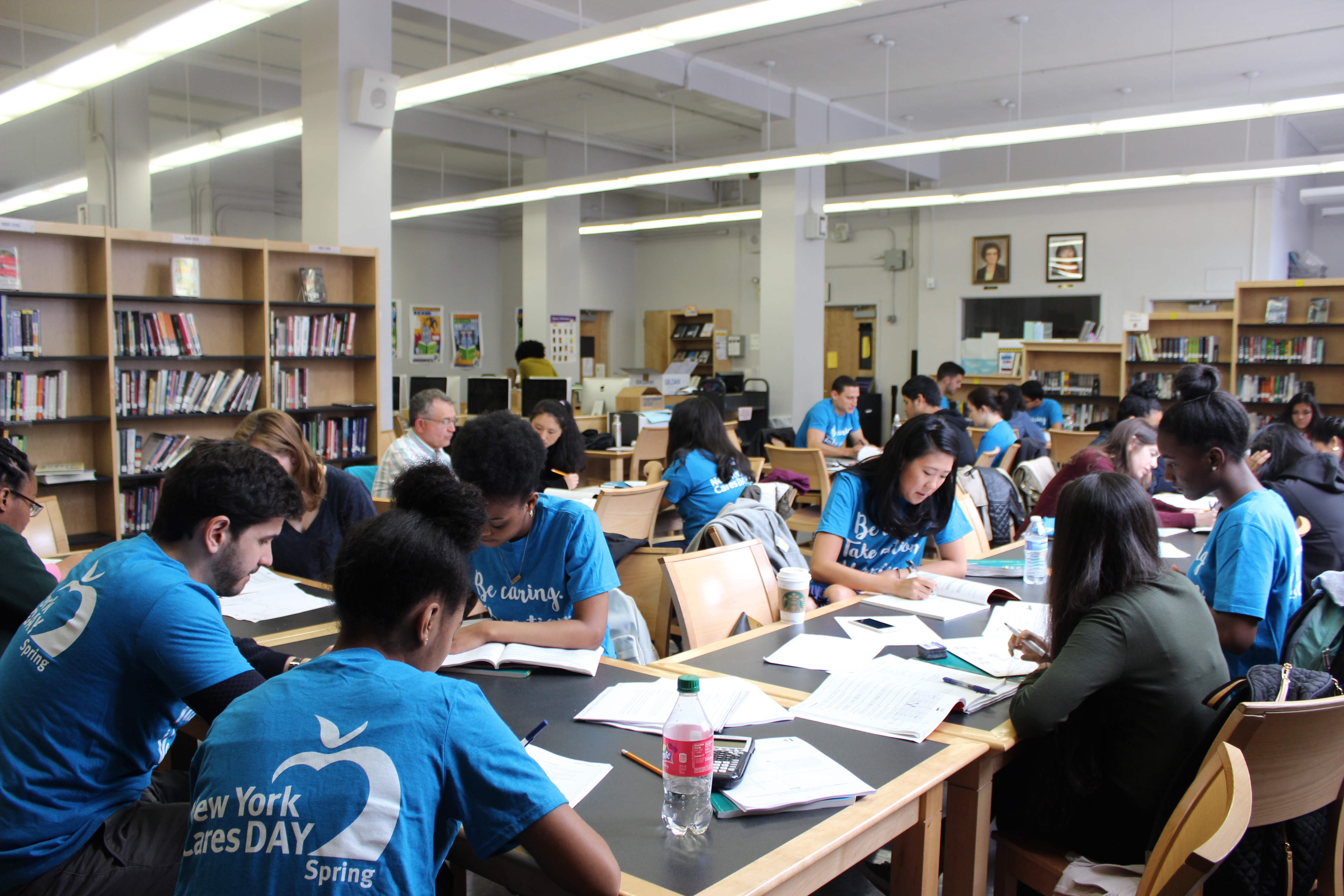 Group of volunteers tutoring students