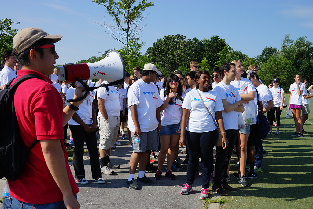 Group of Barclays volunteers ready to start revitalization tasks outdoors