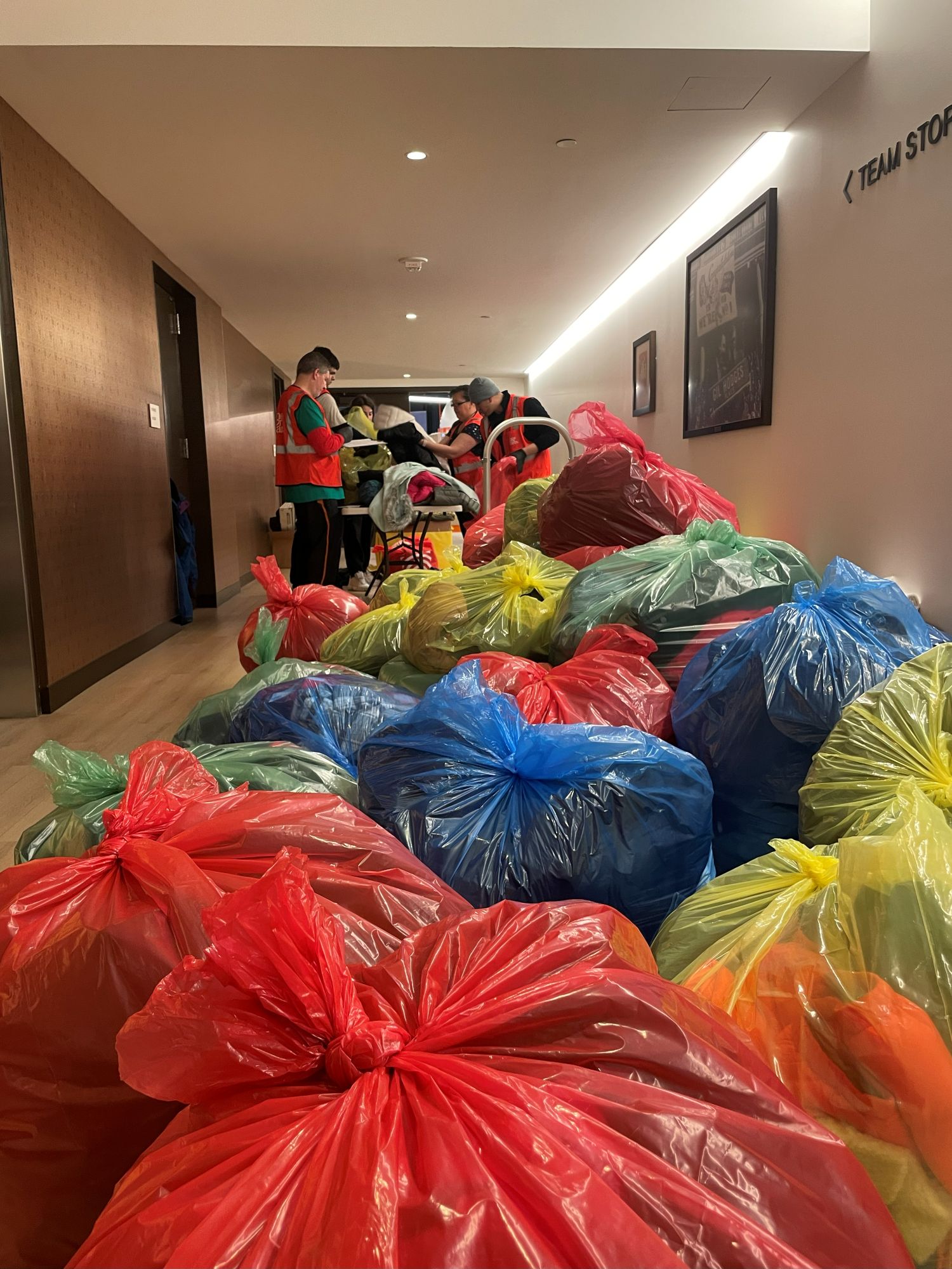 Volunteers sorting coats